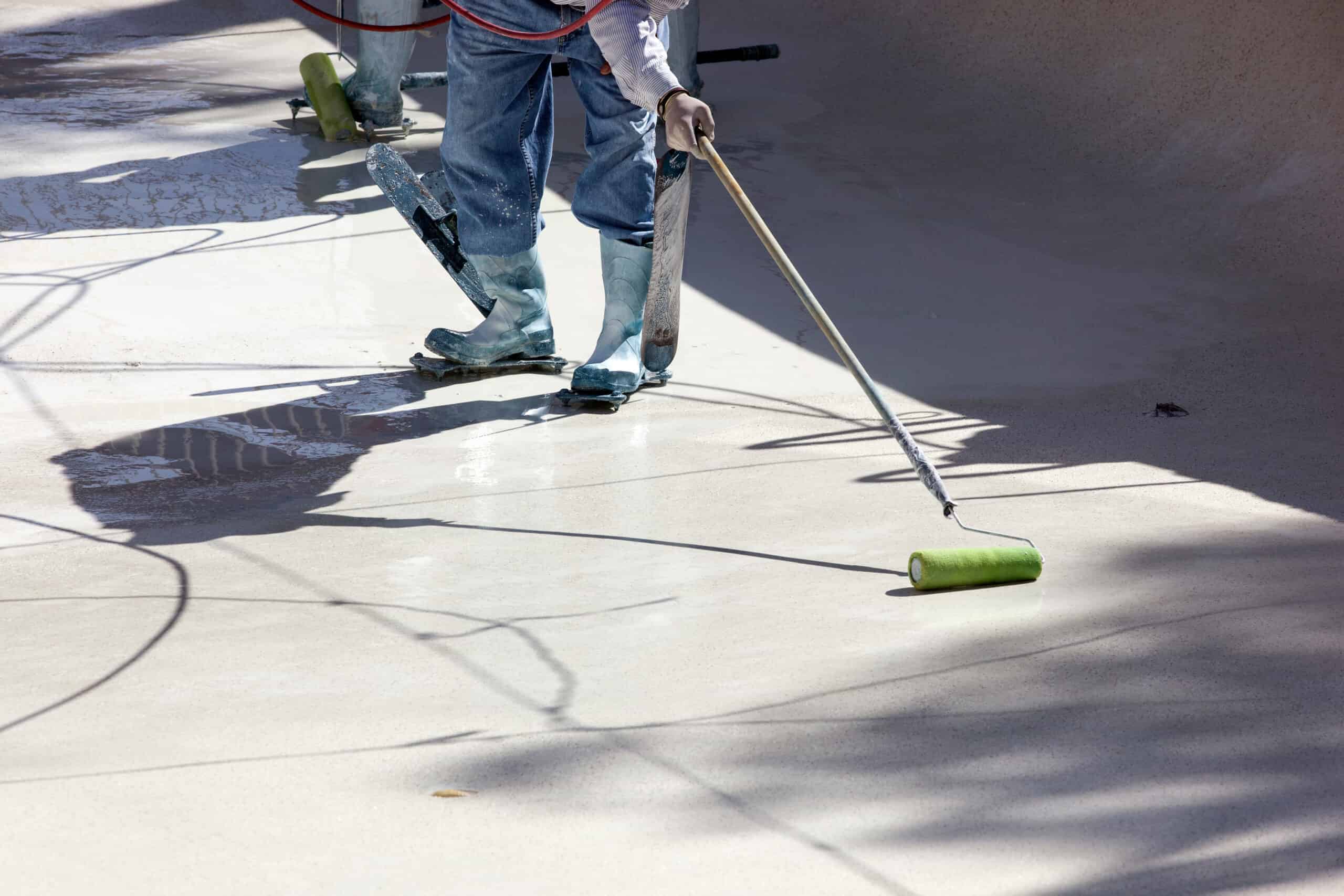 pool renovation expert working on a Brisbane pool